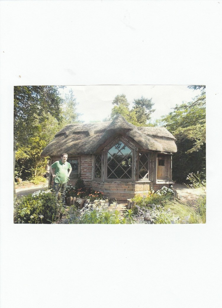 Jamie in front of the children's play house at Charlecote Park NT 2013