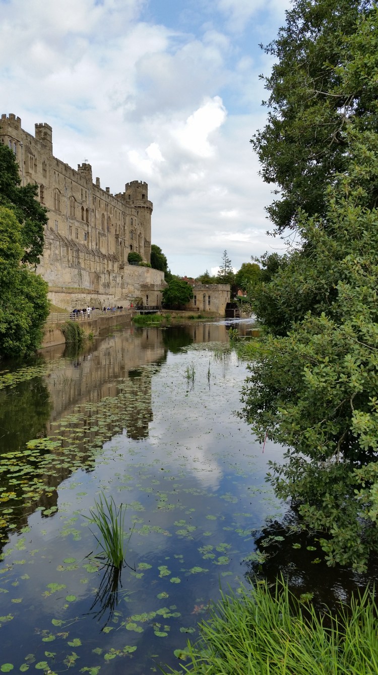 view of Warwick Castle from the river island bridge