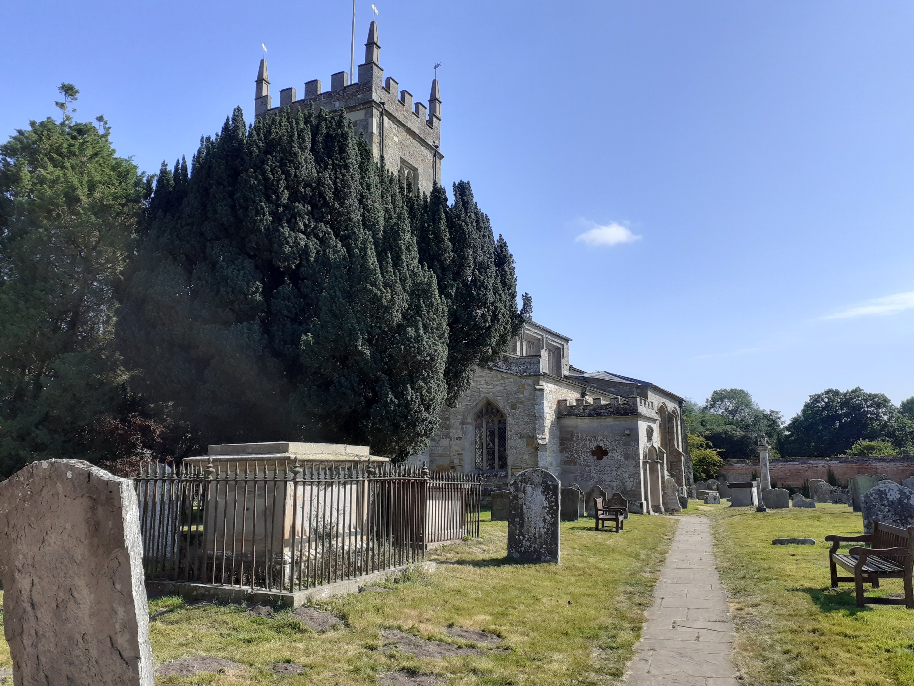 Anglican church of St Peter and graveyard at Coughton Court Warwickshire